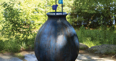Evelyn Rydz, Holding Water, 2025, cast glass, steel, concrete, field stones. Courtesy of the artist. Photo: Mel Taing. At deCordova Sculpture Park and Museum.