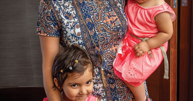 Becky Field, FieldWorkPhotos, An Afghan mother and her two girls wait for her husband to complete his citizenship ceremony, 2017, photograph. At The Gallery at WREN.